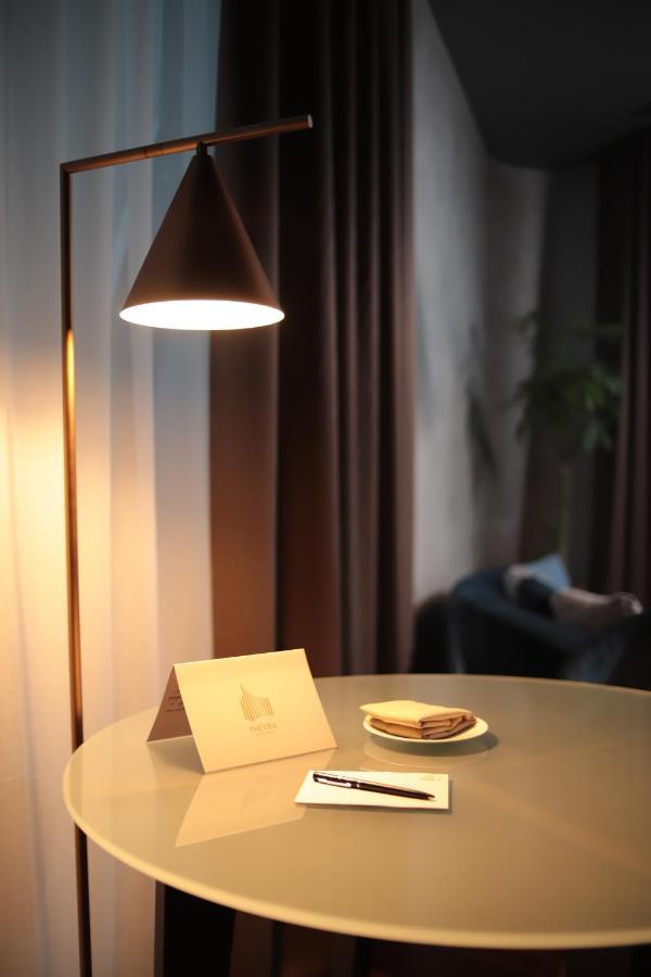 The Veil Hotel Astana Exterior foto A floor lamp