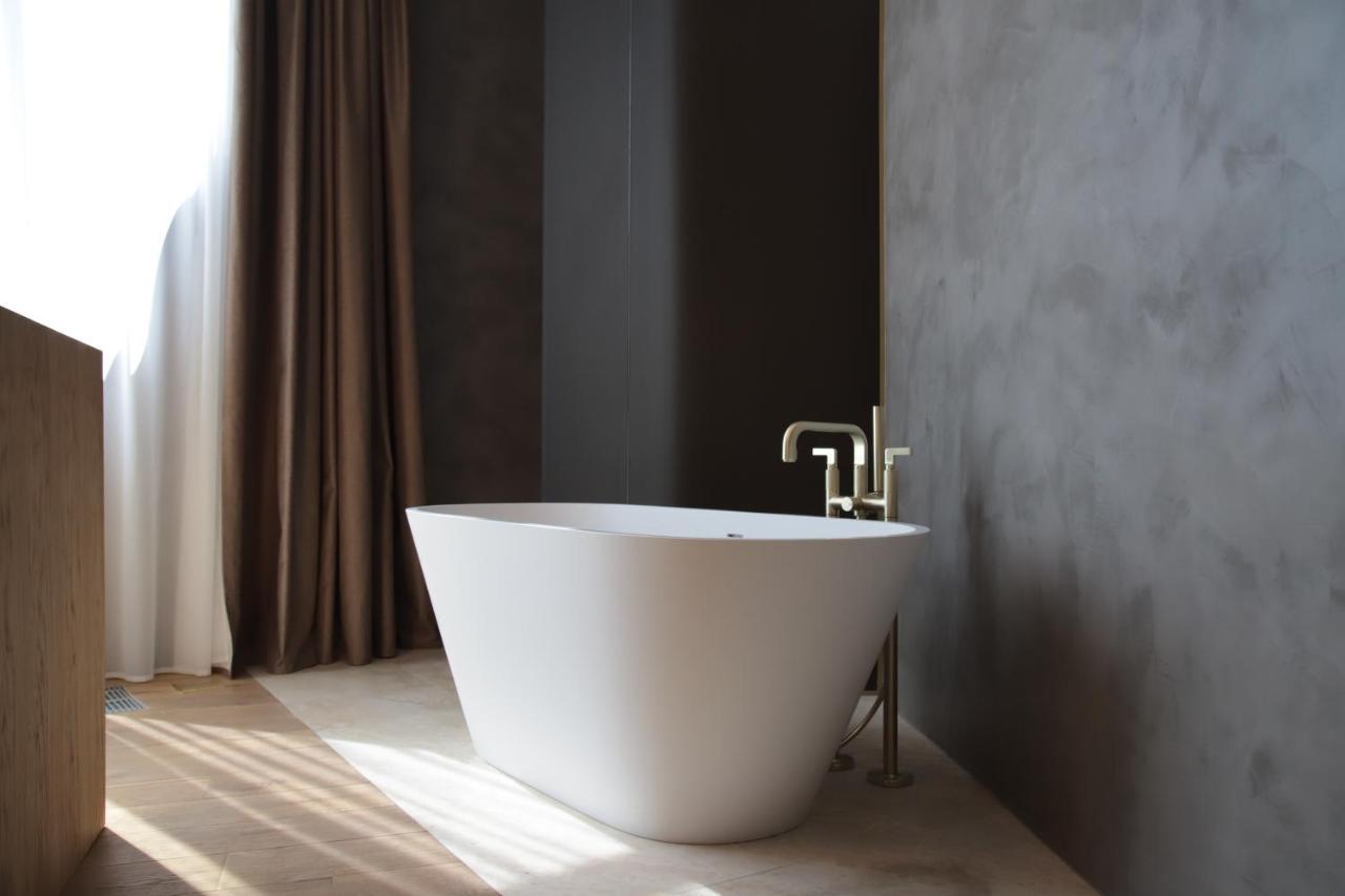 The Veil Hotel Astana Exterior foto A freestanding bathtub